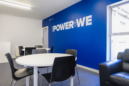 'power of we' branding on a wall in our office