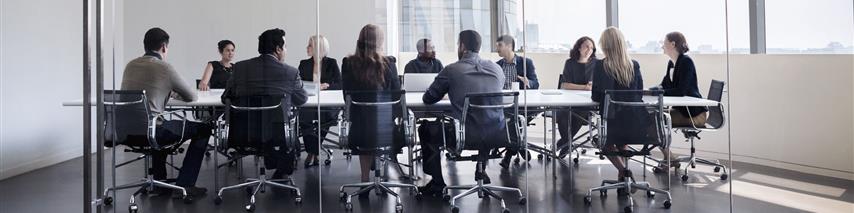 Large meeting room filled with commercial insurance experts